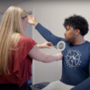 A physical therapy student measures a patient's arm range of motion 